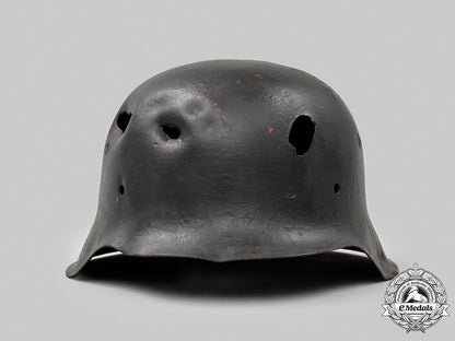 germany,_heer._a_battle-_damaged_m42_stahlhelm_050_m21_mnc9369-copy_1