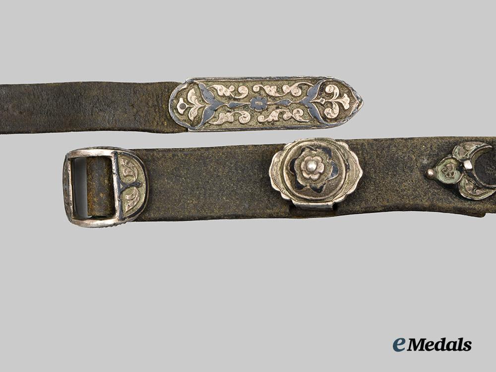 russia,_imperial._an_ornate_leather_belt_with_hand_etched_silver_fittings__a_i1_5719-_recovered