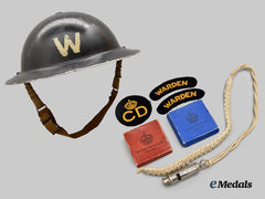 United Kingdom. A Second War Air Raid Precaution Warden Helmet with Whistle and Uniform Accompaniments