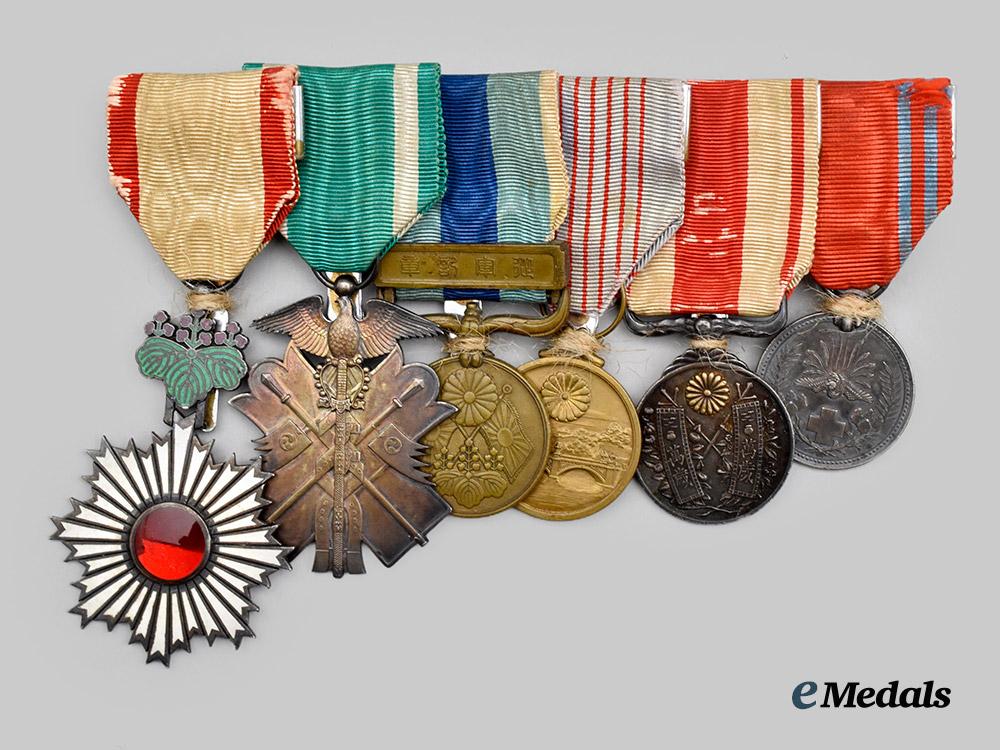 japan,_empire._a_medal_bar_to_a_highly_decorated_second_war_veteran(_rising_sun/_golden_kite/1904-05_war/_taisho_enthronement/_red_cross)___m_n_c3076