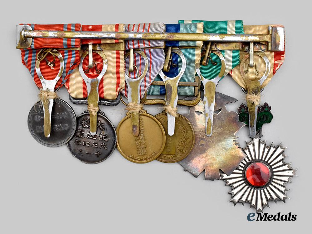 japan,_empire._a_medal_bar_to_a_highly_decorated_second_war_veteran(_rising_sun/_golden_kite/1904-05_war/_taisho_enthronement/_red_cross)___m_n_c3077