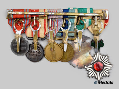 japan,_empire._a_medal_bar_to_a_highly_decorated_second_war_veteran(_rising_sun/_golden_kite/1904-05_war/_taisho_enthronement/_red_cross)___m_n_c3077