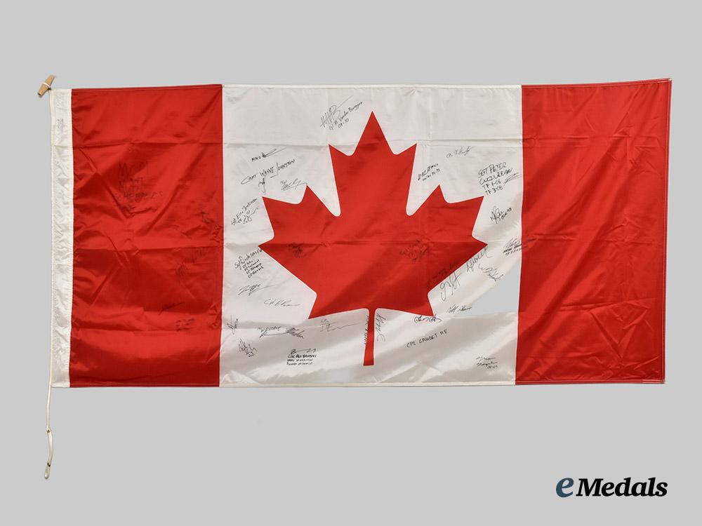 canada,_commonwealth._a_canadian_flag_signed_by_captain_wayne_johnston,_founder_of_the_wounded_warriors_fund,_along_with_the_signatures_of_other_members_of_the_canadian_forces___m_n_c3727