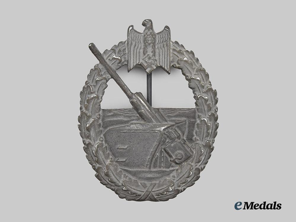 germany,_kriegsmarine._a_coastal_artillery_war_badge,_with_cap_insignia___m_n_c4346