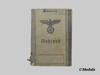 germany,_heer._a_pair_of_wehrpässe,_unissued_and_decorated_eastern_front_service___m_n_c4646