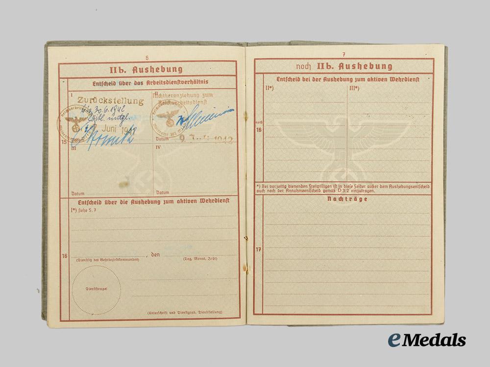 germany,_heer._a_pair_of_wehrpässe,_unissued_and_decorated_eastern_front_service___m_n_c4650