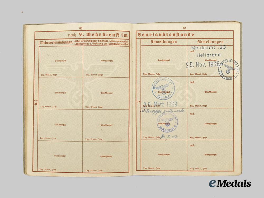 germany,_heer._a_pair_of_wehrpässe,_unissued_and_decorated_eastern_front_service___m_n_c4674