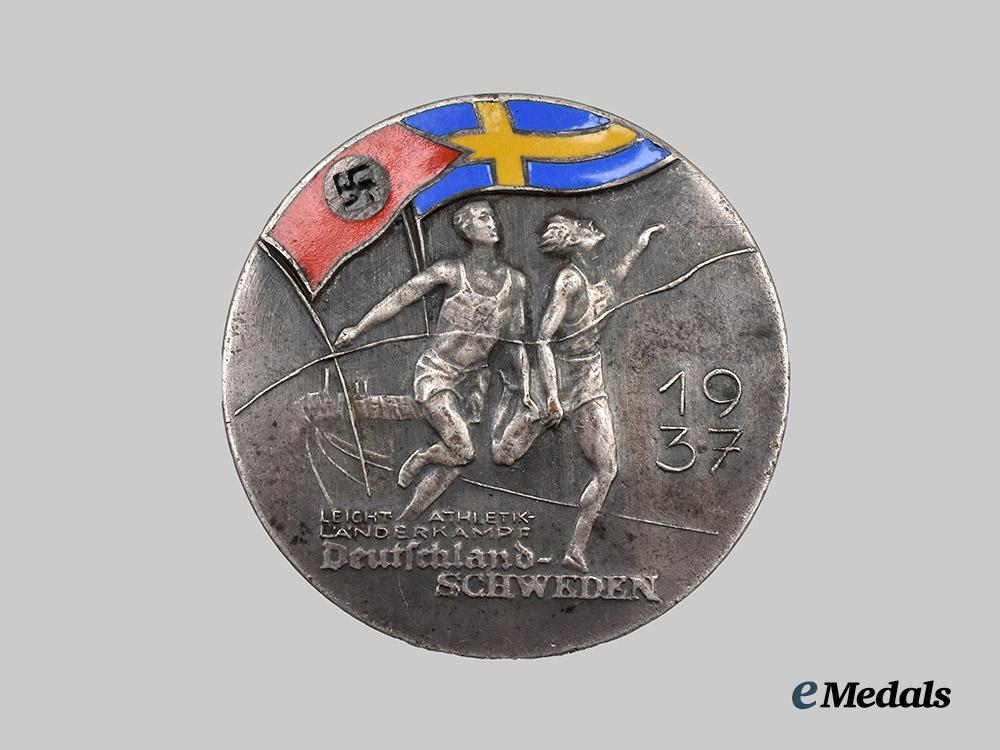 germany,_third_reich._a1937_germany-_sweden_athletics_competition_commemorative_badge,_by_deschler&_sohn___m_n_c4739