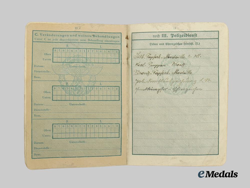 germany,_ordnungspolizei._a_pair_of_service_passes_to_decorated_officers,_with_feldpost_postcard___m_n_c4784