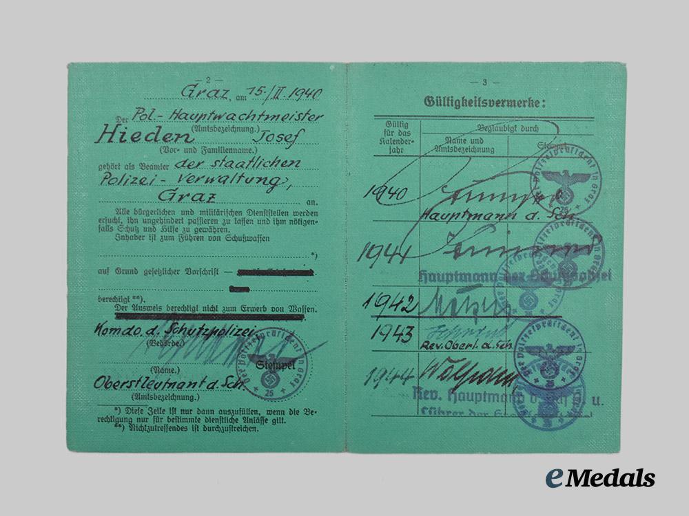 germany,_ordnungspolizei._a_lot_of_service_passes_to_decorated_officers,_with_postcard___m_n_c4795