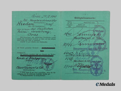 germany,_ordnungspolizei._a_lot_of_service_passes_to_decorated_officers,_with_postcard___m_n_c4795