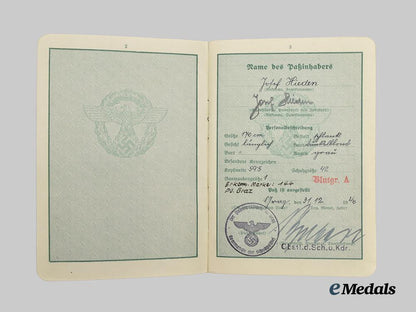 germany,_ordnungspolizei._a_lot_of_service_passes_to_decorated_officers,_with_postcard___m_n_c4797