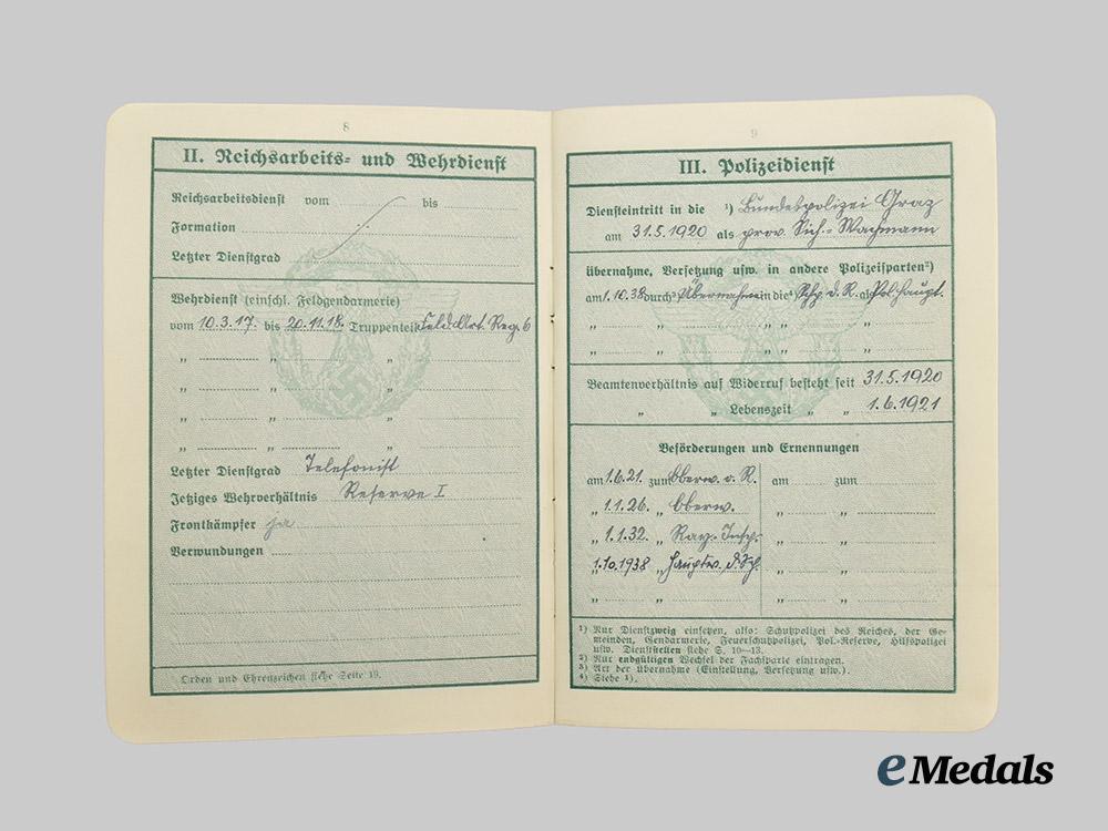 germany,_ordnungspolizei._a_lot_of_service_passes_to_decorated_officers,_with_postcard___m_n_c4799