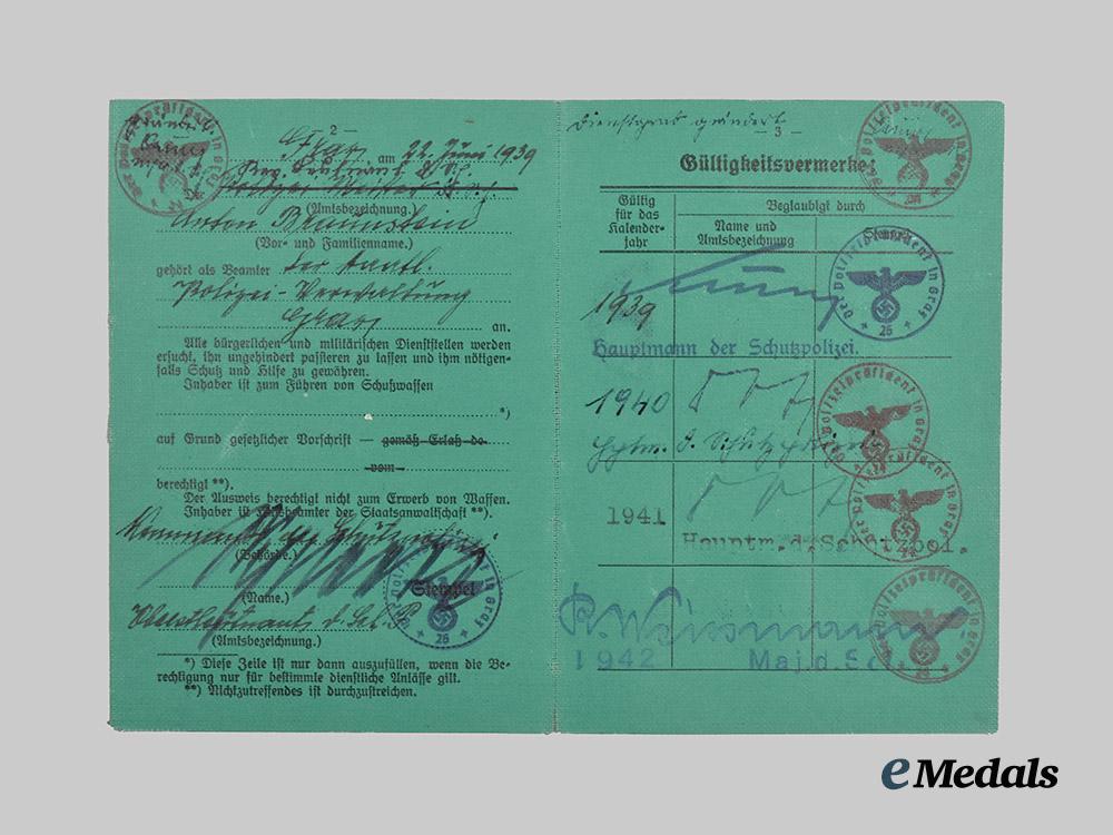 germany,_ordnungspolizei._a_lot_of_service_passes_to_decorated_officers,_with_postcard___m_n_c4804