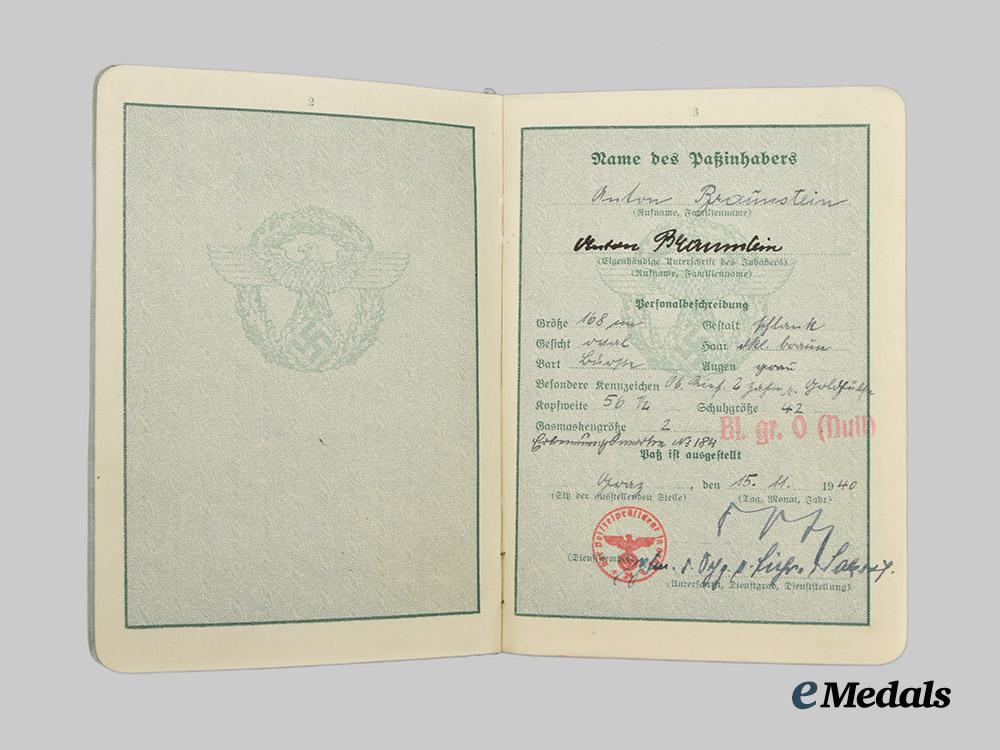 germany,_ordnungspolizei._a_lot_of_service_passes_to_decorated_officers,_with_postcard___m_n_c4806