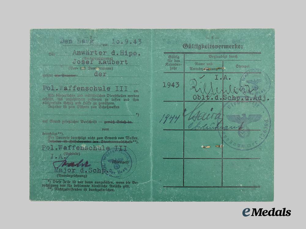 germany,_ordnungspolizei._a_lot_of_service_passes_to_decorated_officers,_with_postcard___m_n_c4814