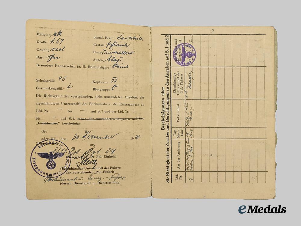 germany,_ordnungspolizei._a_lot_of_service_passes_to_decorated_officers,_with_postcard___m_n_c4817