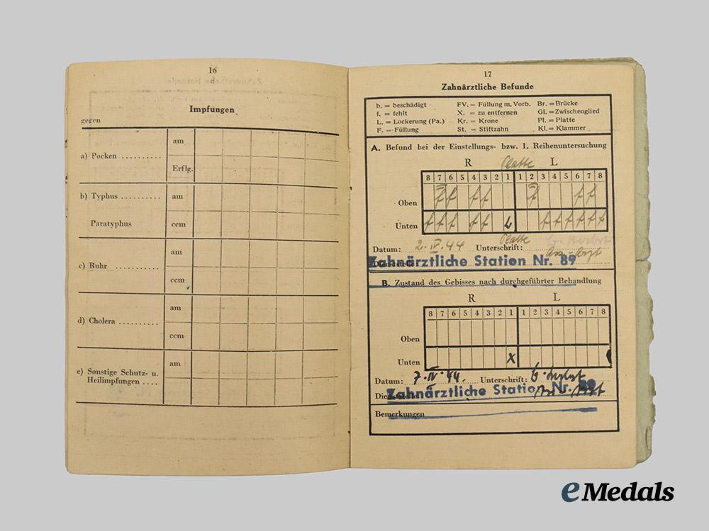 germany,_ordnungspolizei._a_lot_of_service_passes_to_decorated_officers,_with_postcard___m_n_c4820