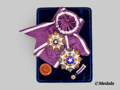 China, Kuomintang Era. A Cased Order of the Brilliant Star, III. Class Set