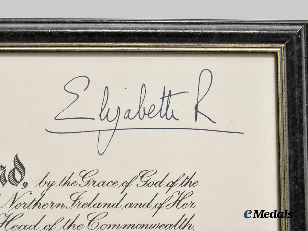 united_kingdom._a_framed_o_b_e_award_document_signed_by_queen_elizabeth&_prince_philip___m_n_c6655