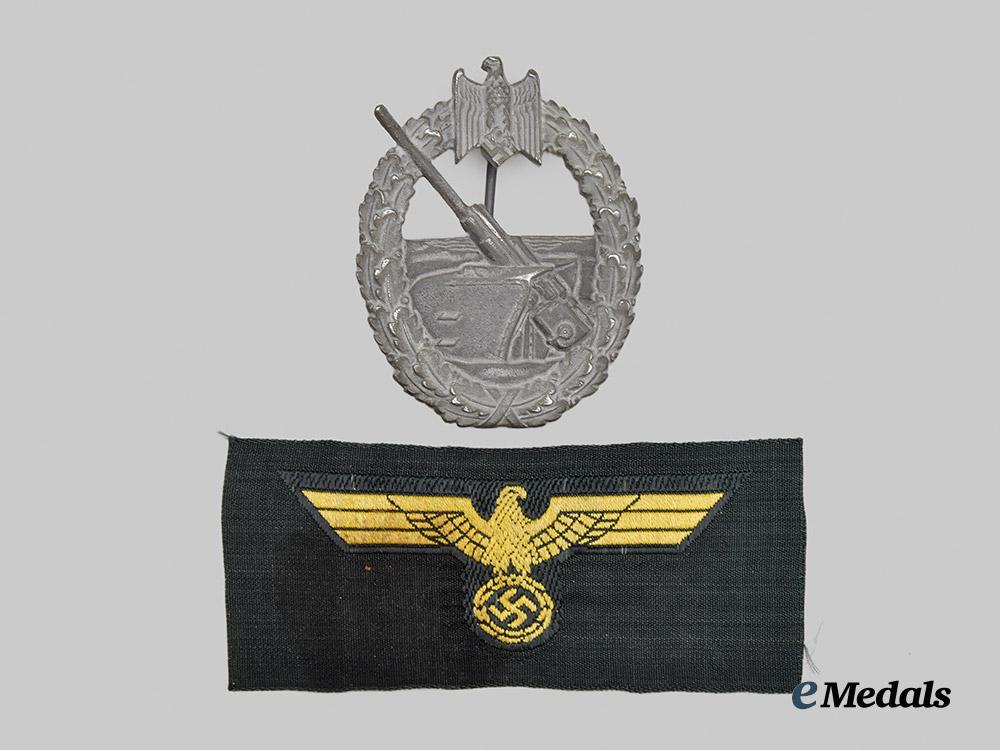 germany,_kriegsmarine._a_coastal_artillery_war_badge,_with_cap_insignia___m_n_c7220