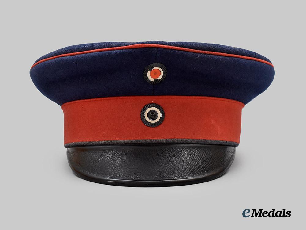 germany,_imperial._a_prussian_infantry_dark_blue_visor_cap,_named_and_unit-_attributed_example,_by_carl_rauschke___m_n_c8233