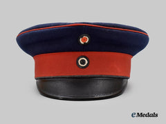 Germany, Imperial. A Prussian Infantry Dark Blue Visor Cap, Named and Unit-Attributed Example, by Carl Rauschke