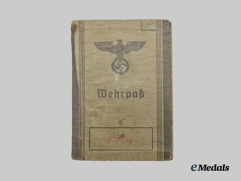 germany,_heer._a_pair_of_wehrpässe,_gebirgsjäger_and_decorated_multi-_front_service___m_n_c9805