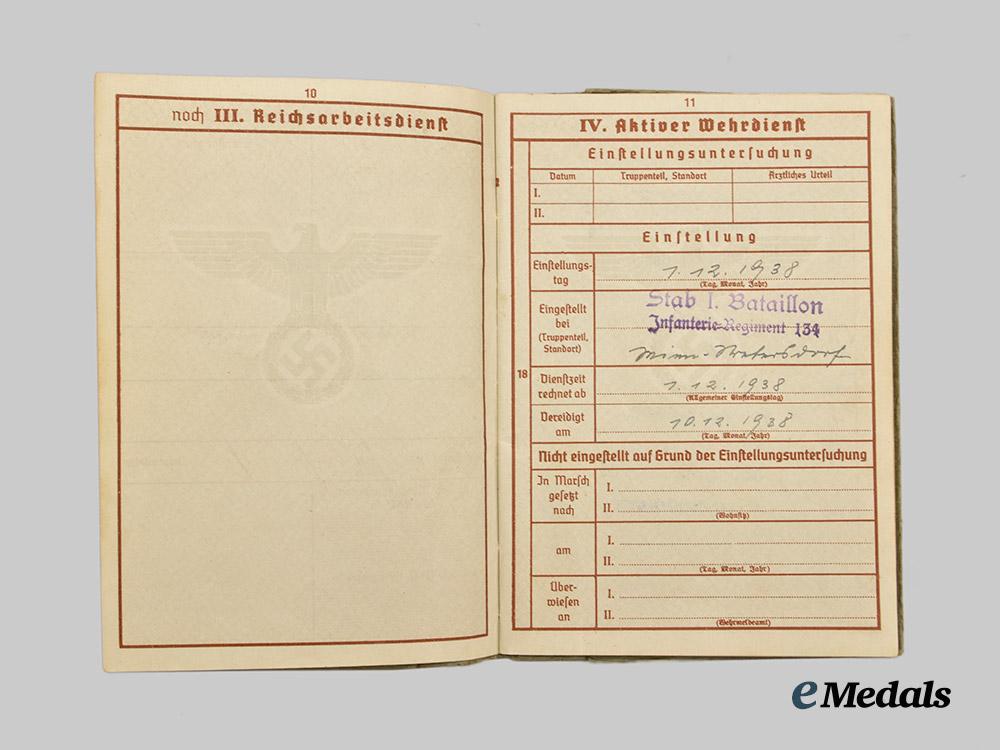 germany,_heer._a_pair_of_wehrpässe,_gebirgsjäger_and_decorated_multi-_front_service___m_n_c9810