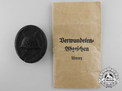 A Mint Black Grade Wound Badge With Packet Of Issue