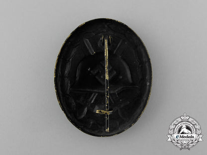 a_second_war_german_black_grade_wound_badge;_tombac_version_in_its_packet_of_issue_aa_1207