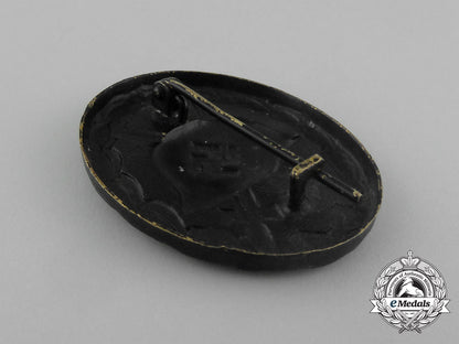 a_second_war_german_black_grade_wound_badge;_tombac_version_in_its_packet_of_issue_aa_1208