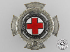 A Prussian Red Cross Ten Year Service Badge By Godet