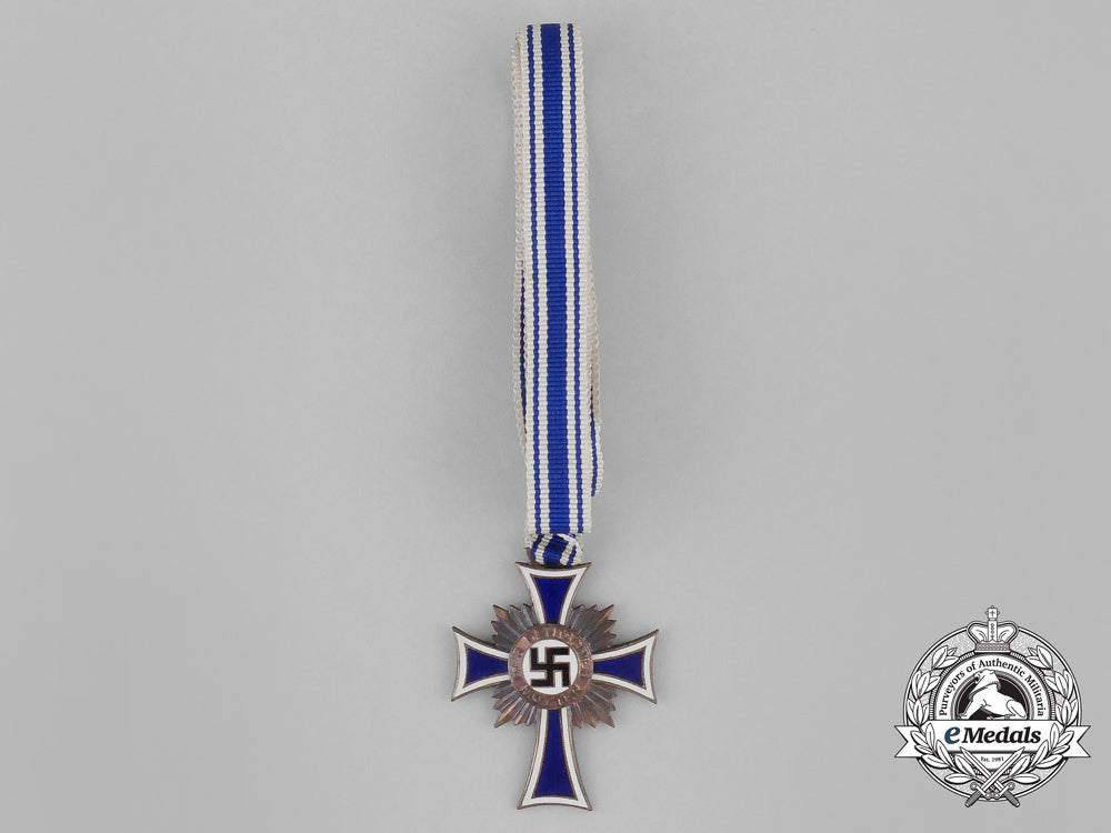 a_german3_rd_class_cross_of_honour_of_the_german_mother_with_its_packet_by_ernst&_müller_bb_2402