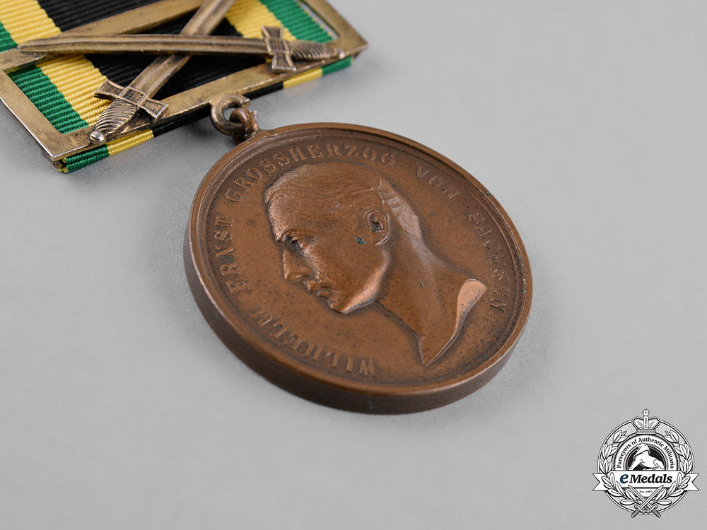 saxony,_kingdom._a_general_medal_of_merit,_bronze_grade,_with_sword_clasp_c18-023559