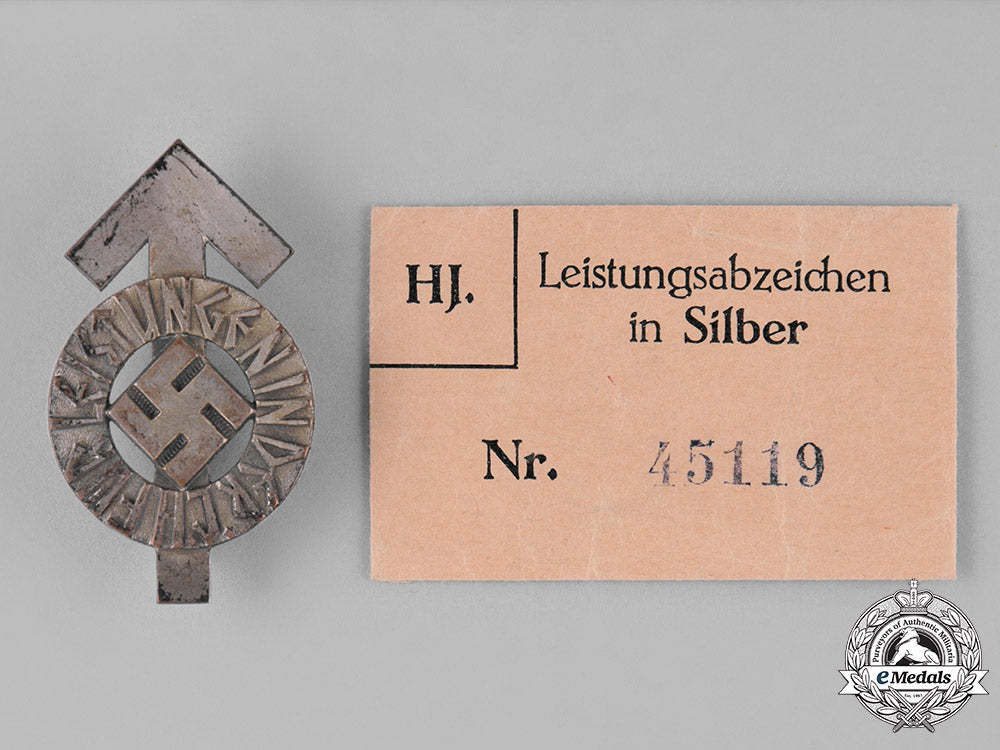 germany._an_hj_proficiency_badge,_silver_grade,_with_its_original_paper_packet_of_issue_c18-026261