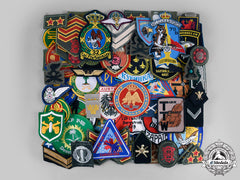 International. A Lot Of Seventy-Four Regimental Insignia