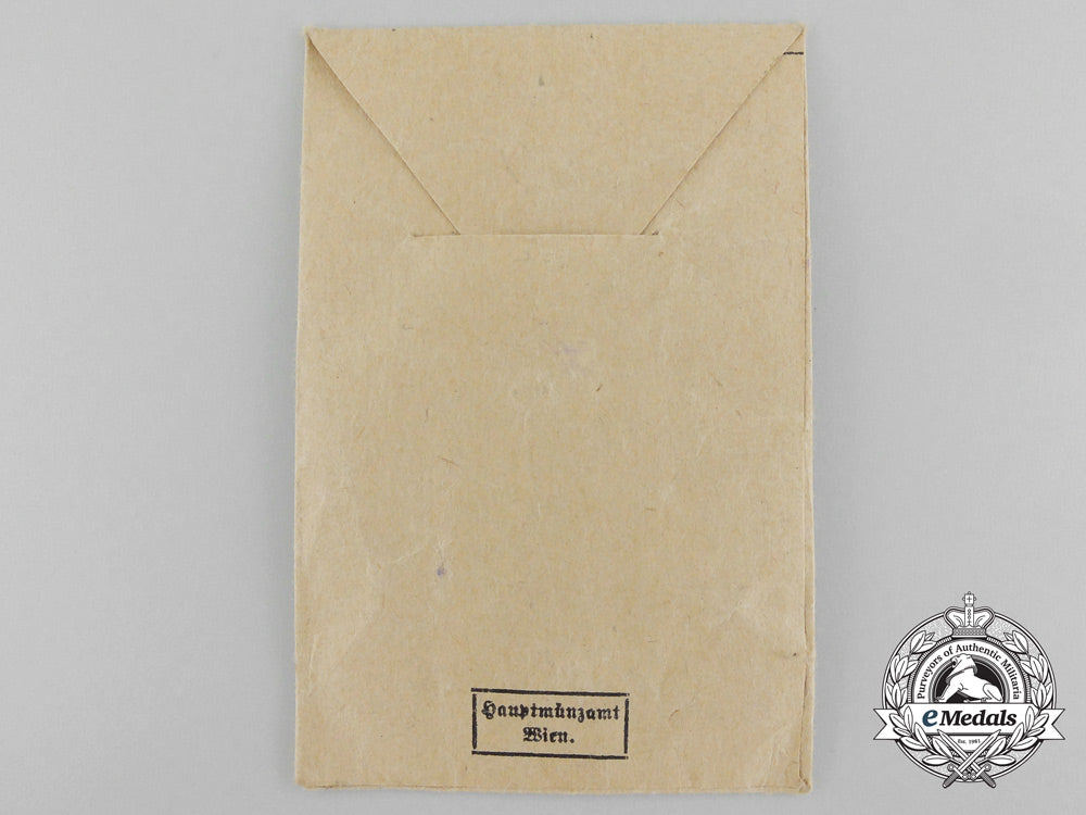 a_mint_black_grade_wound_badge_with_packet_by_hauptmünzamt,_wien_c_3477