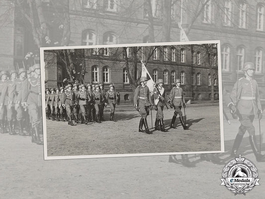 germany,_heer._a_wartime_period_photo_of_a_marching_infantry_unit_with_flag_bearer_cc_3519