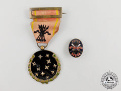 A Spanish Fascist Party Member's Medal And Lapel Badge