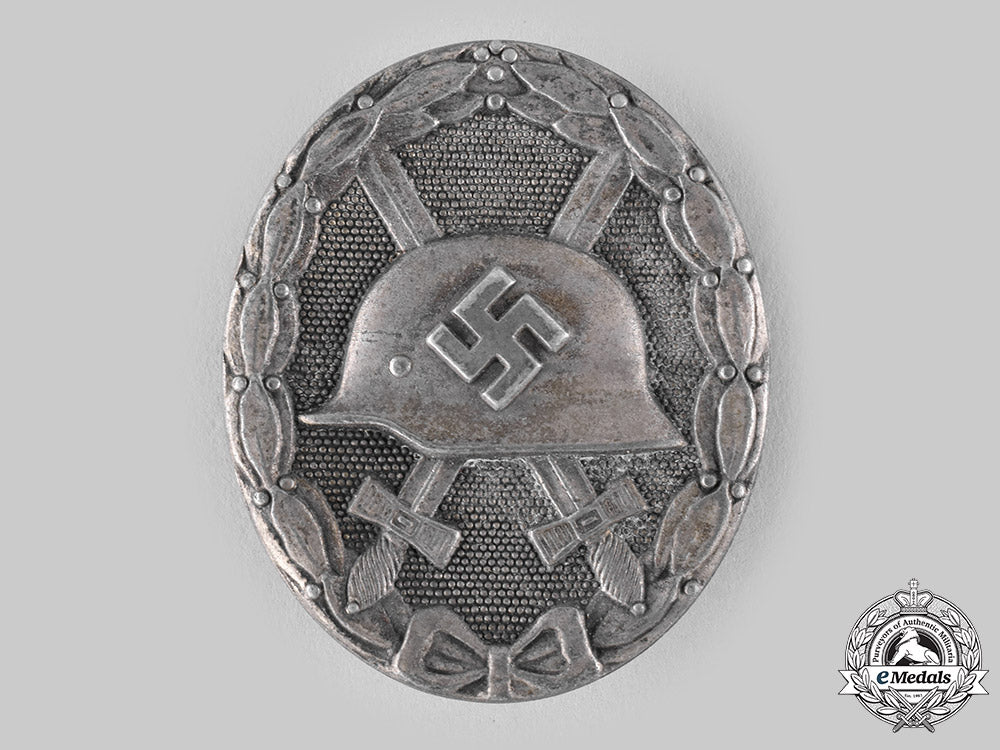 germany,_wehrmacht._a_wound_badge,_silver_grade_by_the_vienna_mint,_with_award_document_to_rudolf_bogda_ci19_6094