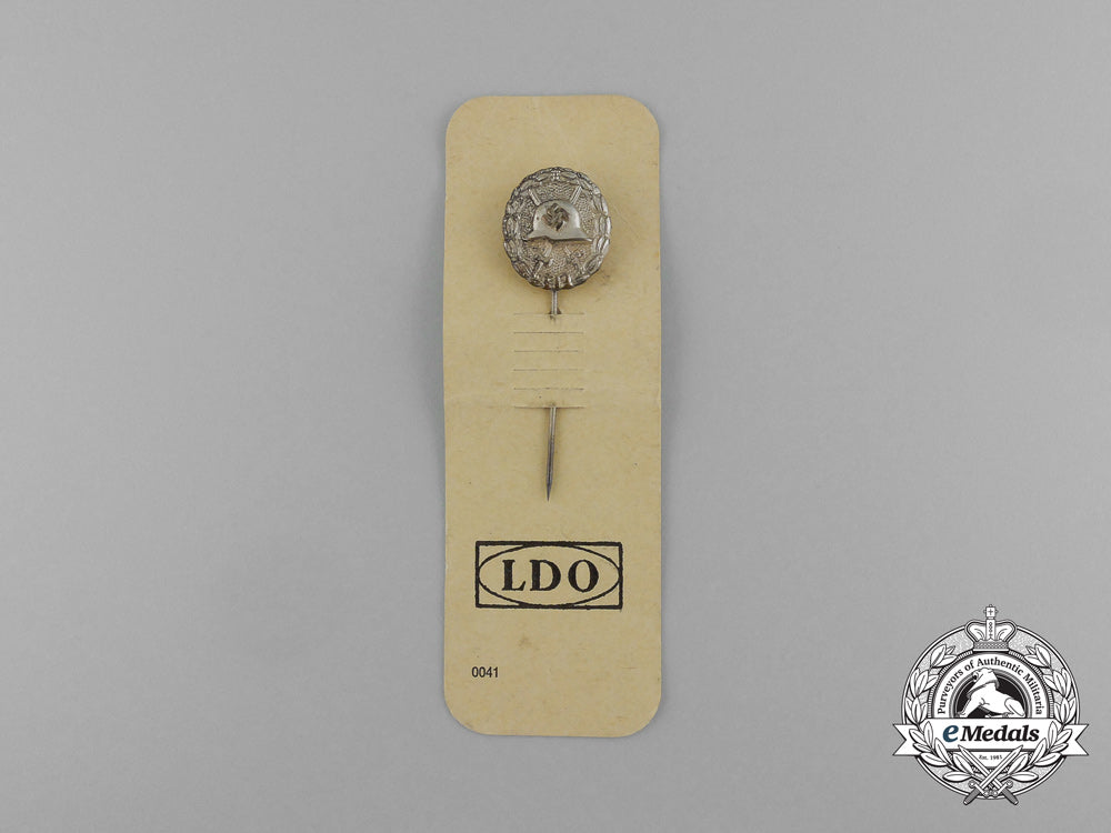 a_miniature_legion_condor_wound_badge_stick_pin_on_its_original_ldo_salesman’s_board_e_1663