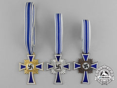 A Grouping Of All Three Grades Of Mother’s Crosses; Gold, Silver, And Bronze Grade