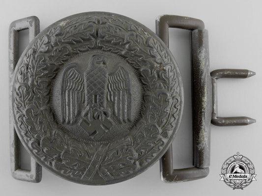 a_tropical_army_officer's_belt_buckle;_published_example_h_922