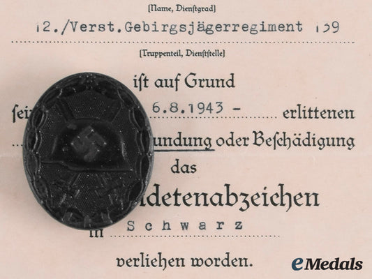 germany,_heer._a_wound_badge,_black_grade,_with_award_document_to_grefreiter_helmut_neuber_m20_00403_1